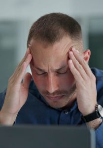 laptop-migraine-man-office-night-tired-2472843377